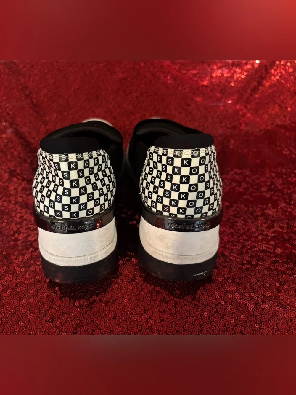 Michael Kors Black and White Slip-On Sneakers with Logo Heel Accent